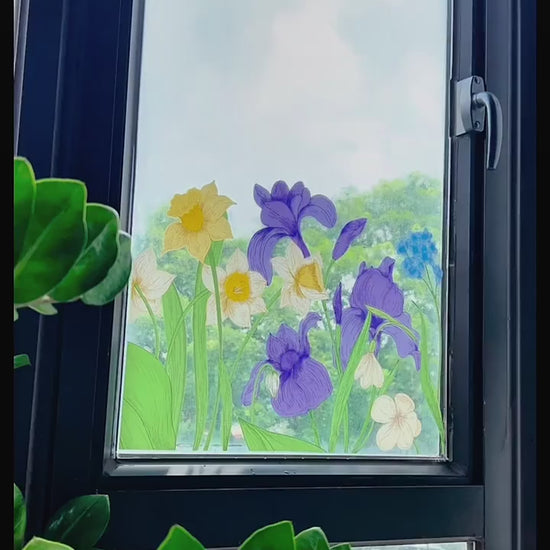 Video of floral window cling sticker on glass showing colourful stained glass effect with flowers and sunlight