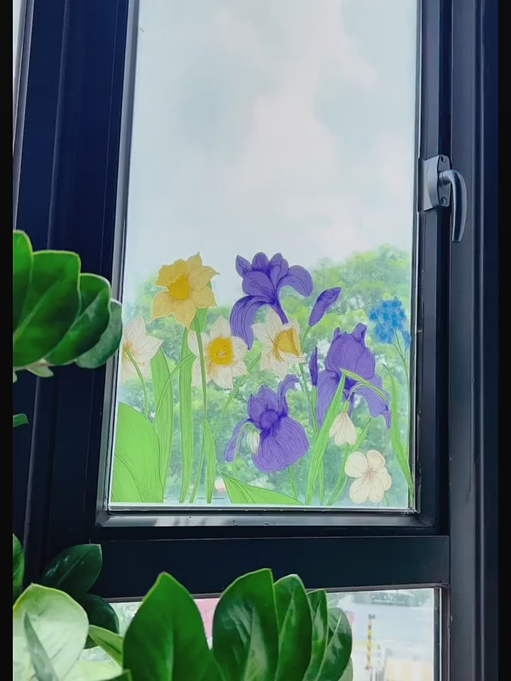 Video of floral window cling sticker on glass showing colourful stained glass effect with flowers and sunlight