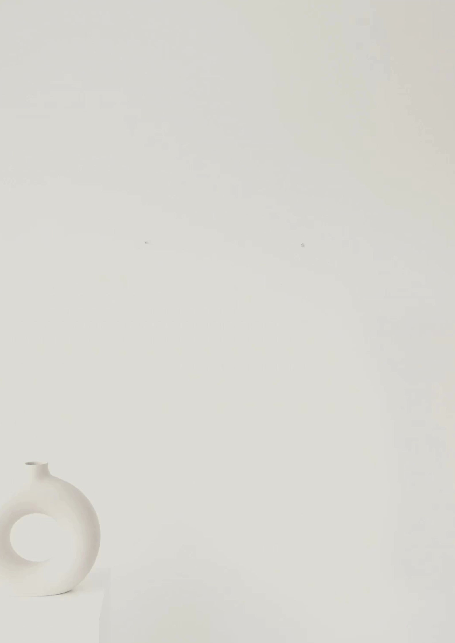 Video of a Minimalist hourglass wall art featuring geometric line work inspired by the science of time on a warm ivory background.