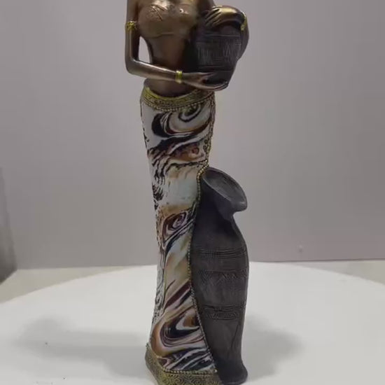 Video of an African-inspired decorative resin woman figurine 
