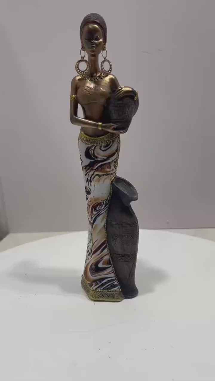 Video of an African-inspired decorative resin woman figurine 