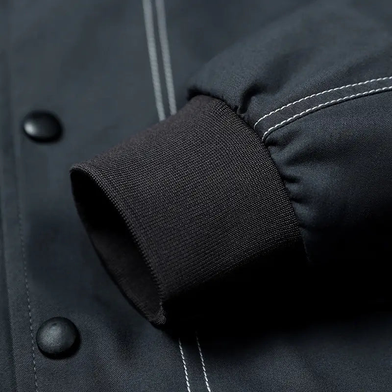 Close-up of a dark jacket with button details