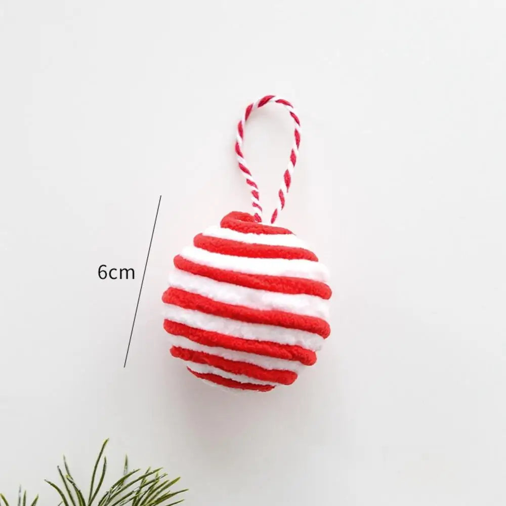 Red and white striped Christmas ornament on a white background with a measurement label.