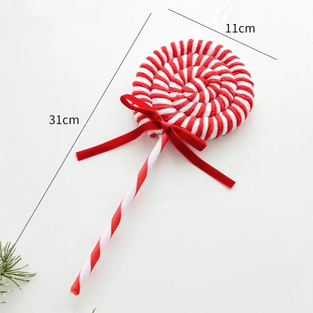 Red and white striped candy-shaped toy with measurements on a white background
