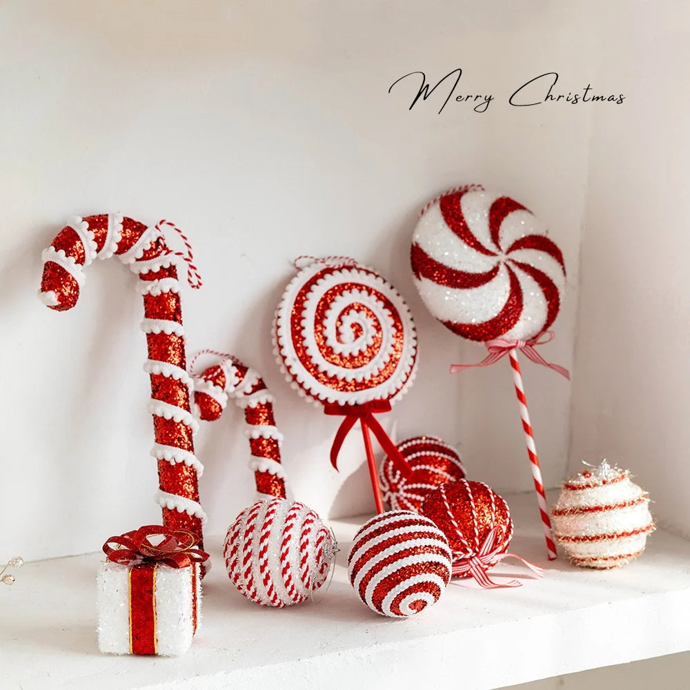 Decorative candy-themed items including a candy cane, lollipops, and a present on a white background with 'Merry Christmas' text.