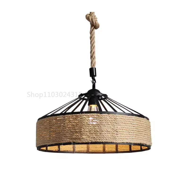 Rustic hemp rope pendant light with industrial metal frame and warm LED bulb, ideal for dining room or café decor.