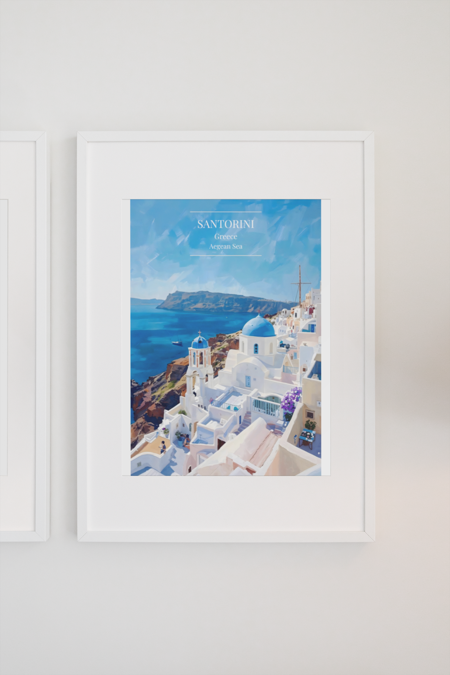 Framed artwork of Santorini with blue domes and white buildings on a wall.