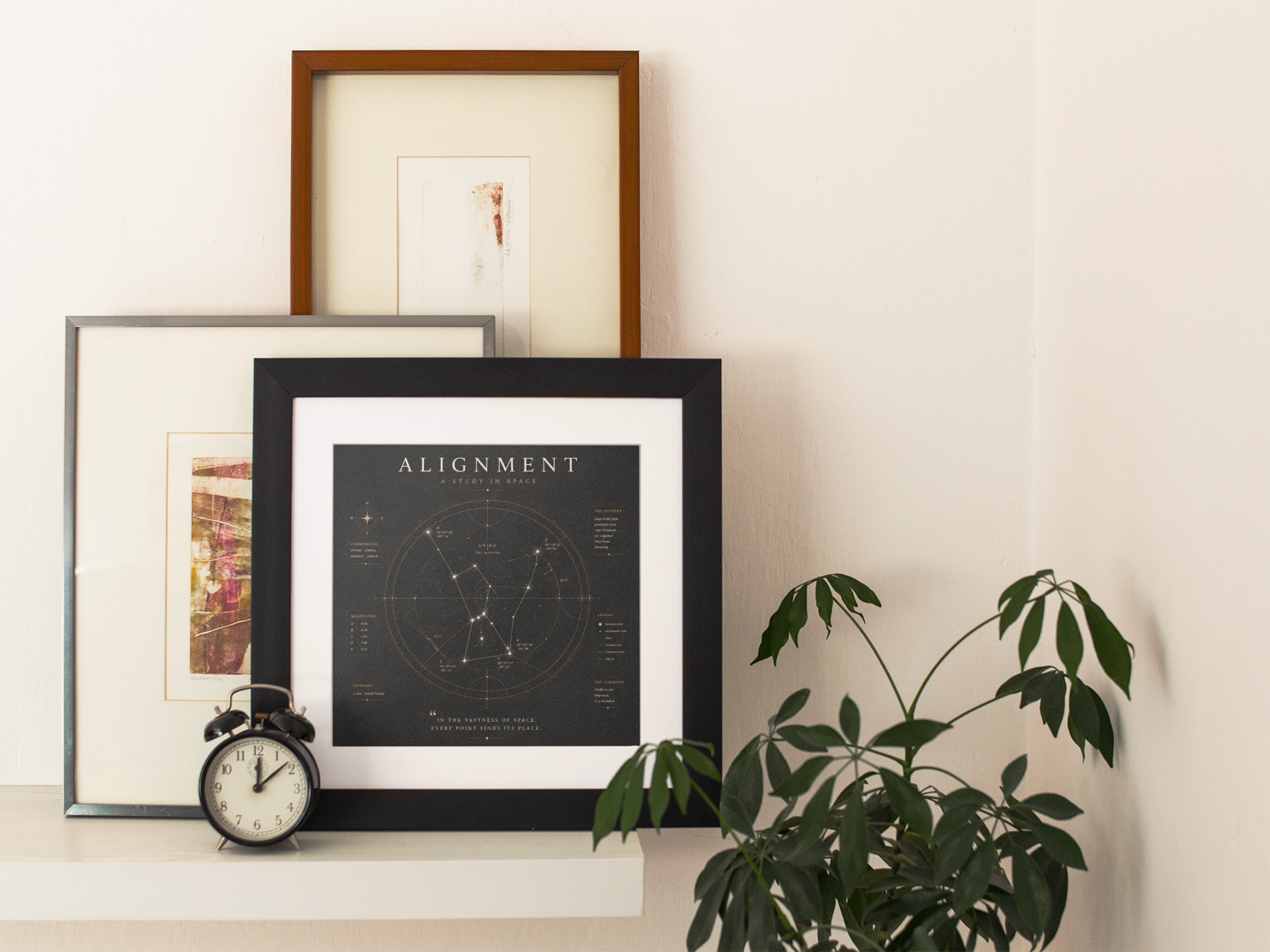 Black constellation wall art leaning against a wall in a contemporary living room with minimalist décor.