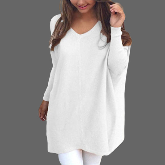 White long-sleeve top worn by a person on a white background