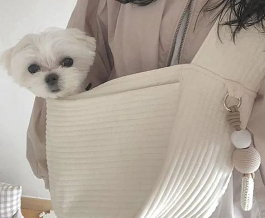 White pet shoulder backpack with a small dog or cat inside â€“ travel carrier for pets