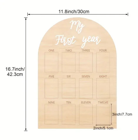 Wooden milestone board with 'My First Year' text and measurements on a white background