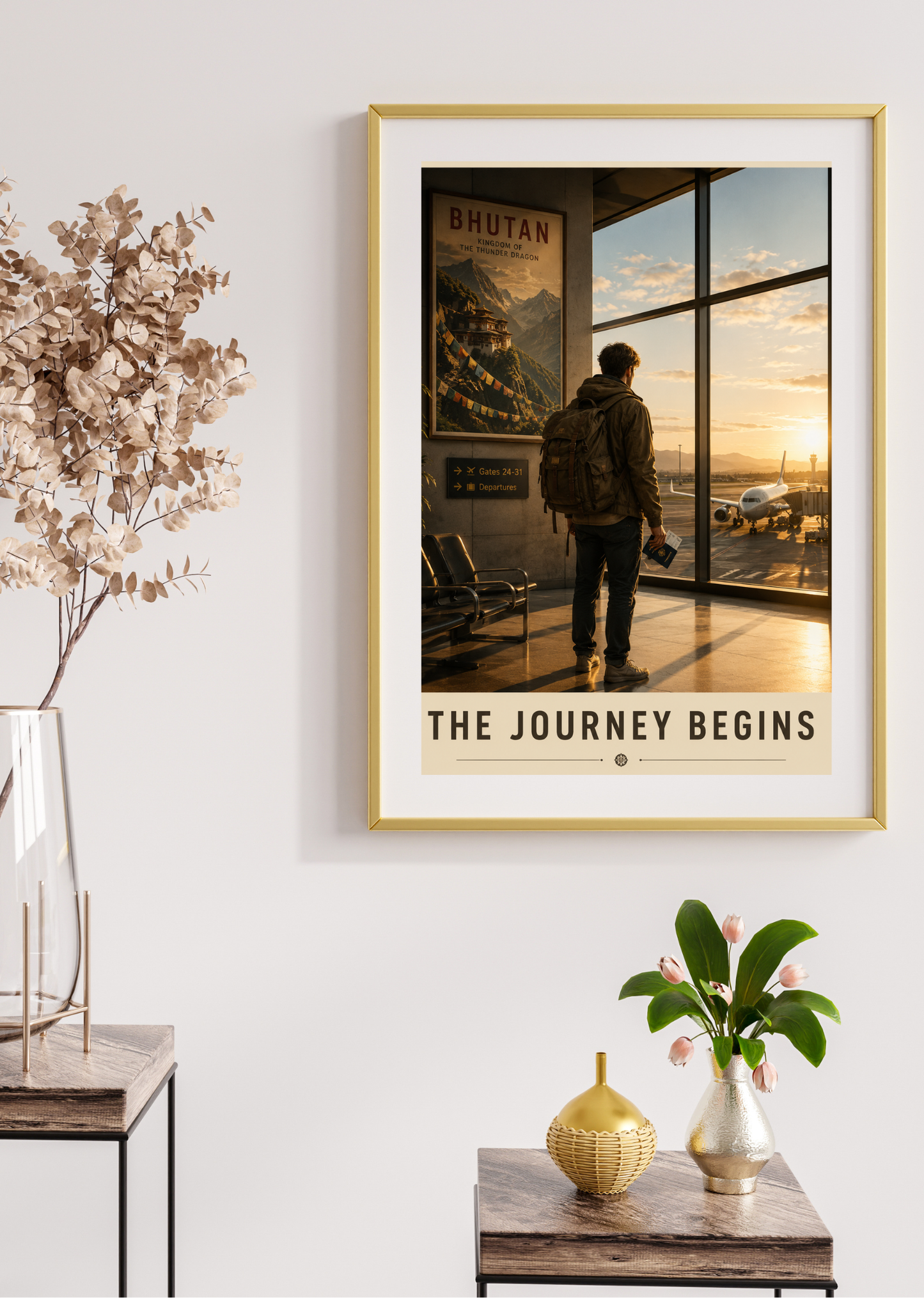 Framed poster of a person looking out a window with 'The Journey Begins' text, placed on a wall above a table with decorative items.