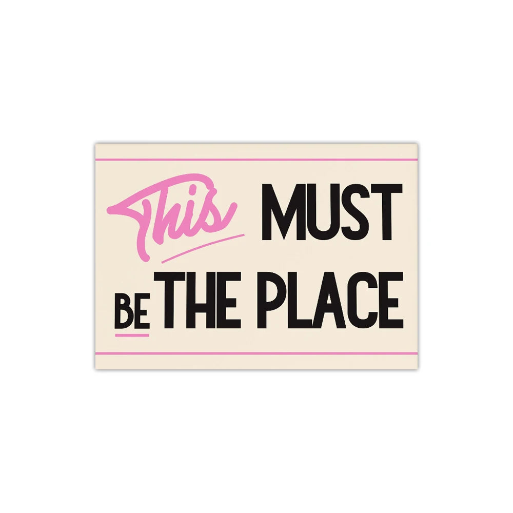 Poster with text 'This Must Be The Place' on a beige background
