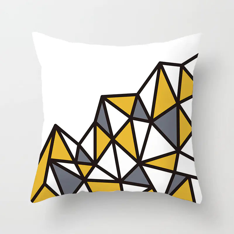 Decorative pillow with geometric triangle pattern on a white background