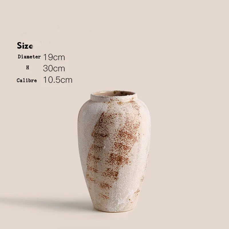 Ceramic vase with textured surface on a beige background