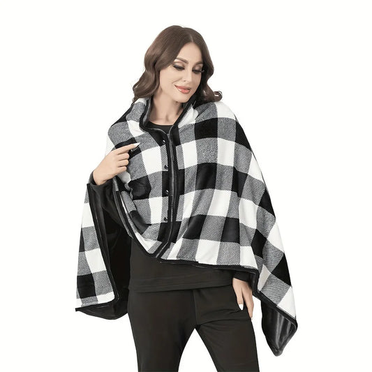 Woman wearing a black and white checkered poncho on a white background