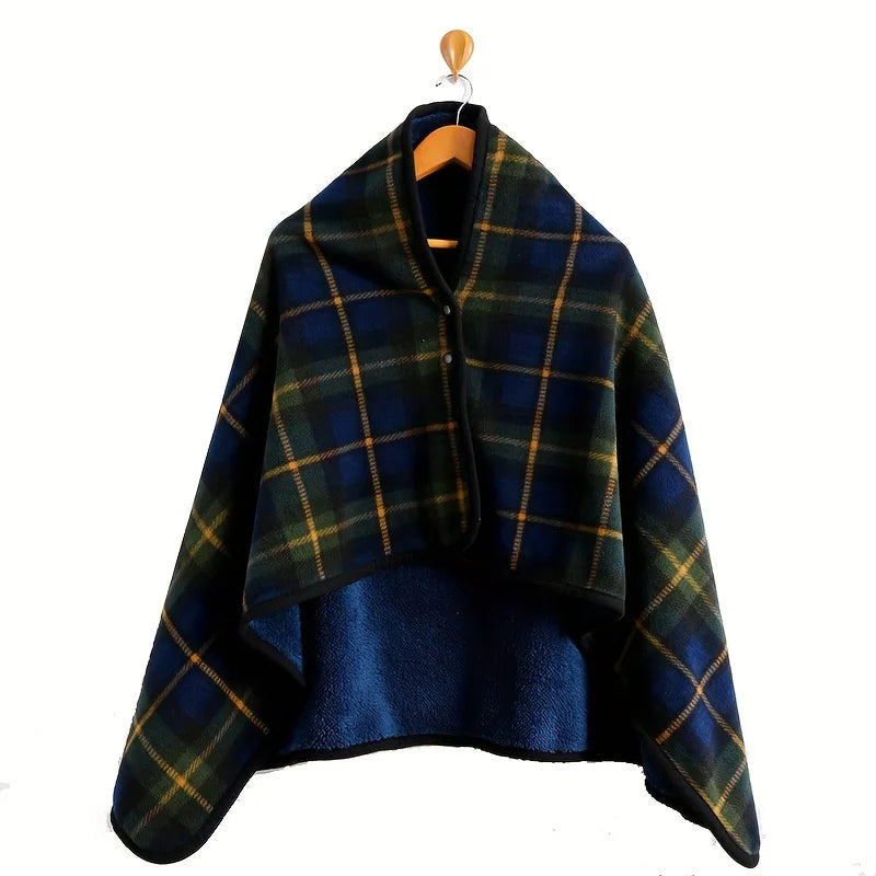 Plaid poncho on a wooden hanger against a white background