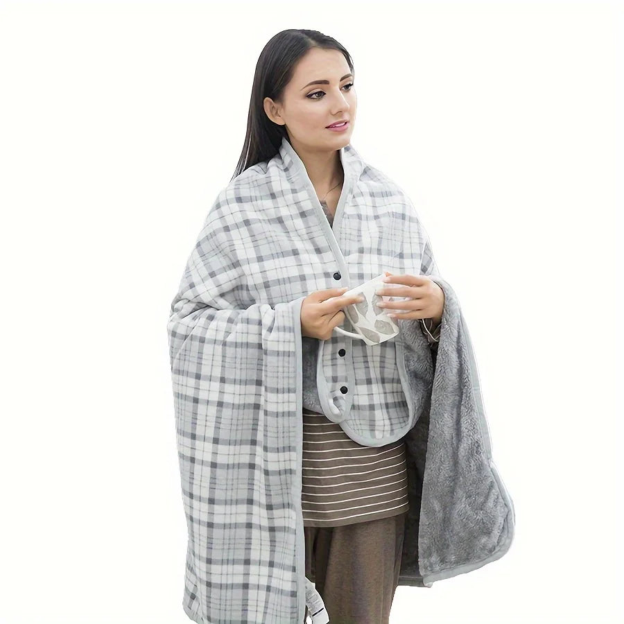 Woman wrapped in a gray checkered blanket holding a white garment on a white background