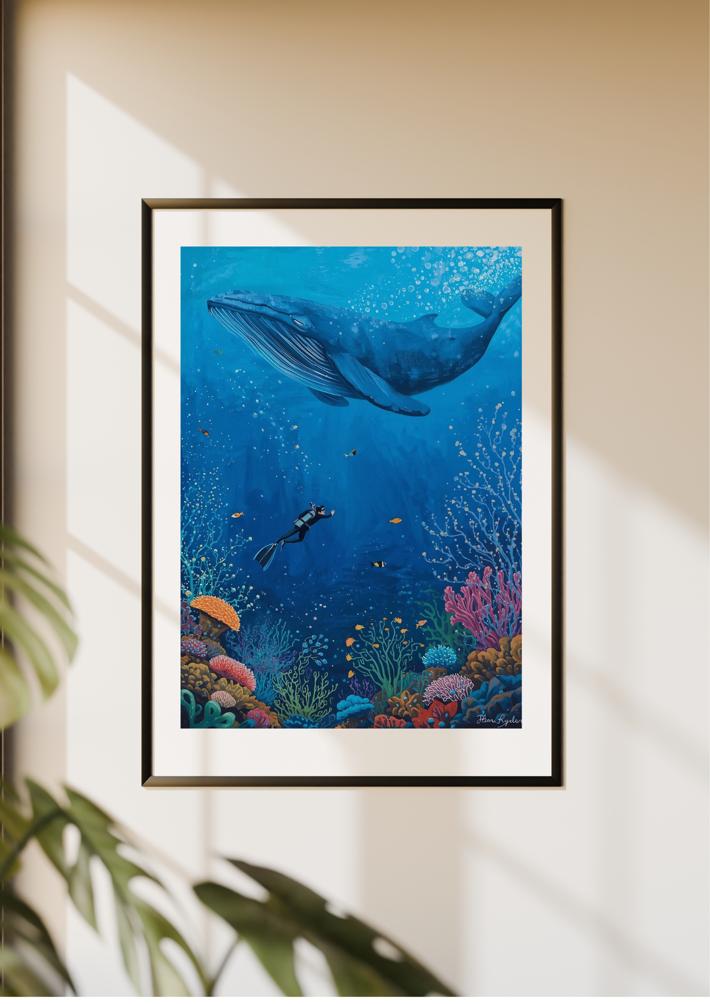 Framed underwater scene with whale and diver on a wall