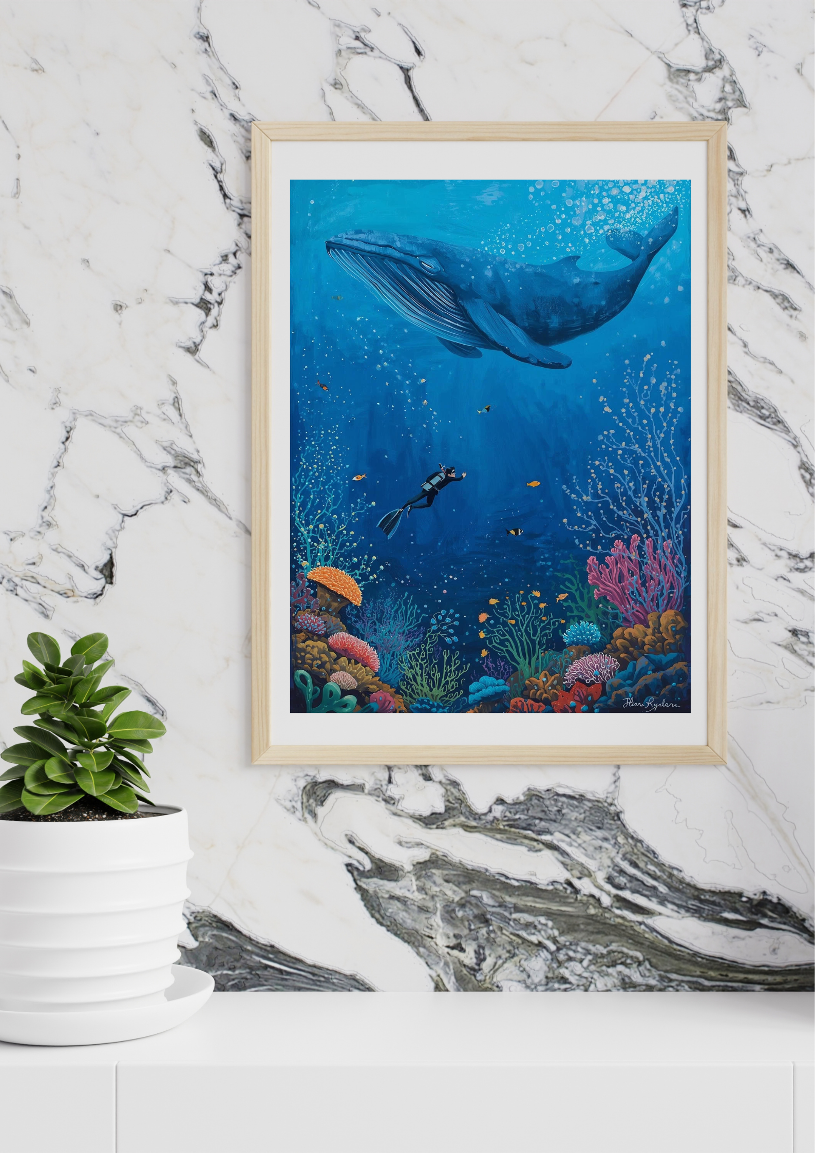 Framed underwater scene with whale and diver on a marble wall
