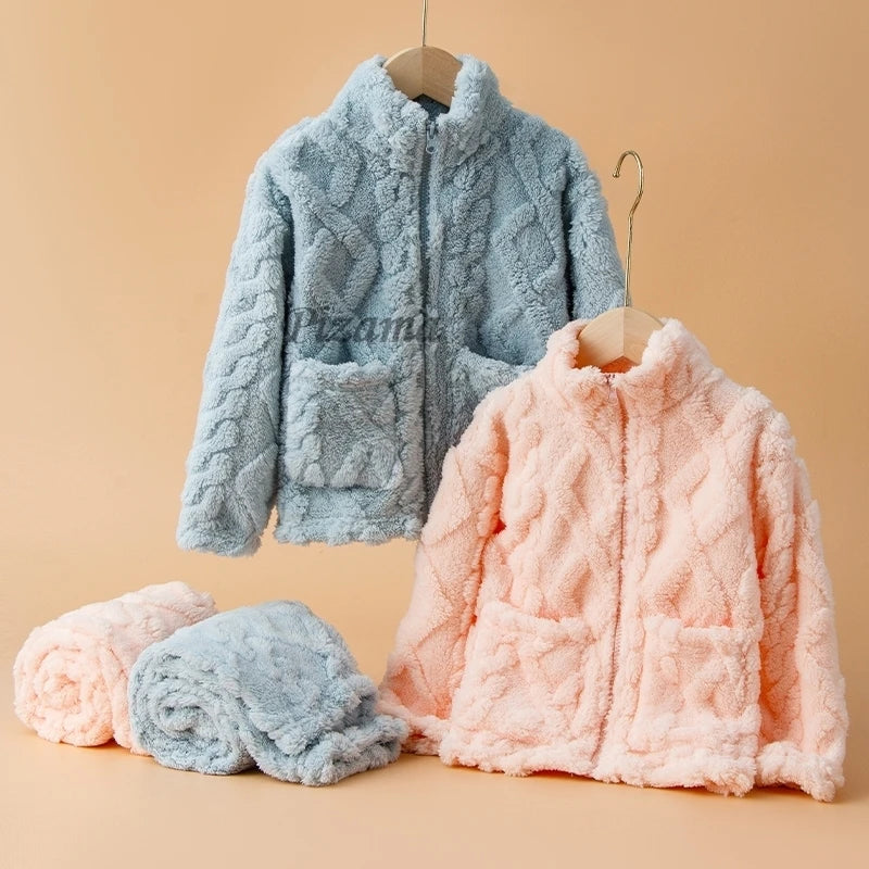 Two fluffy jackets, one blue and one pink, on hangers against a beige background.