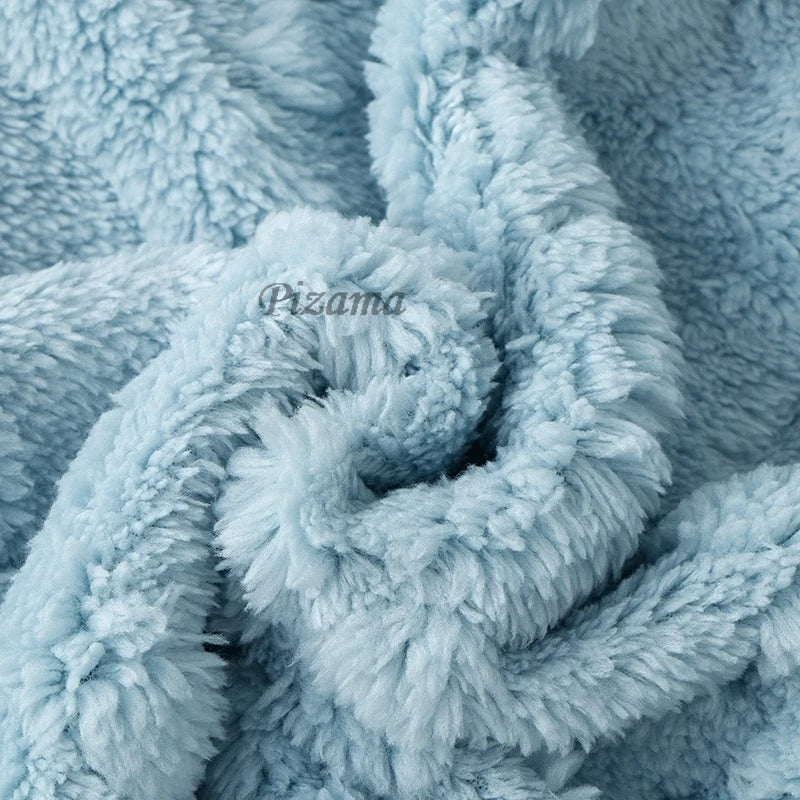 Close-up of textured blue fabric with 'Pizama' branding.