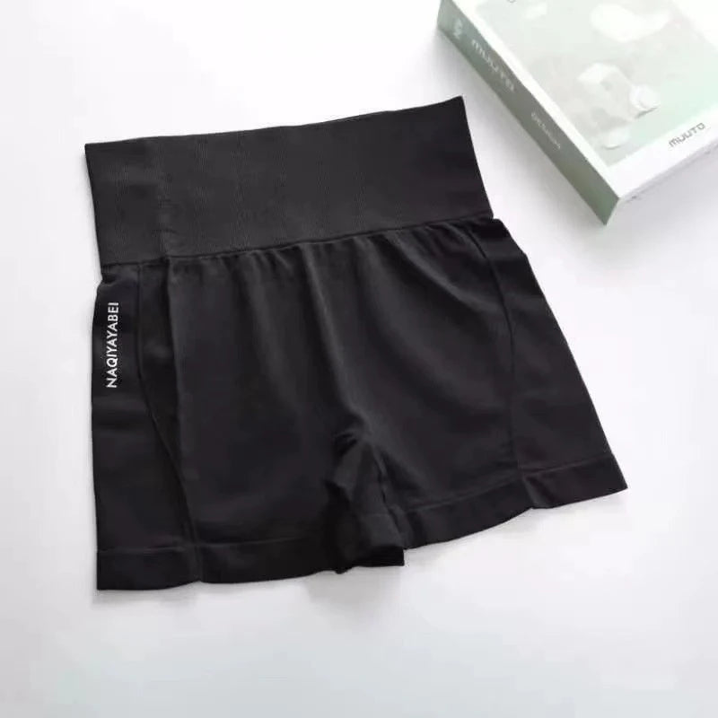Black shorts with a brand label on a white background