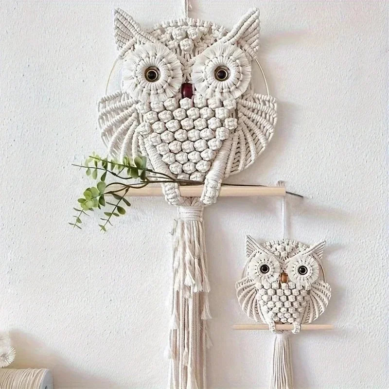 Macrame owl wall hanging with smaller owl below on a white background