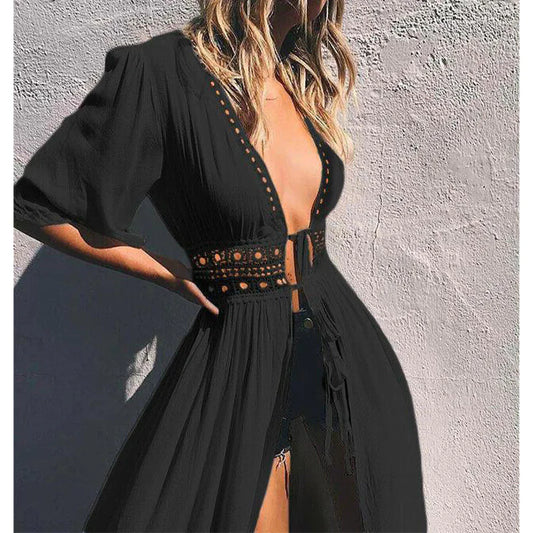 Black dress with cut-out design on a textured wall background